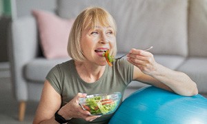 Woman eating salad