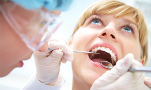 Woman in dental chair for consultation with her cosmetic dentist in Metairie