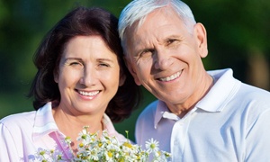 Older couple hugging and smiling