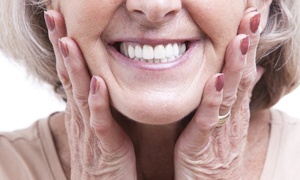 Older lady smiling with dentures in Metairie
