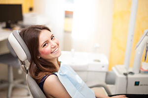 Smiling woman in dental chair