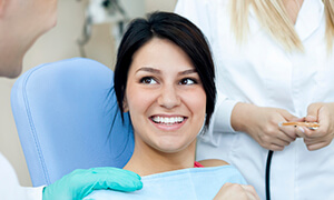 Woman smiling at her dentist during dental checkup