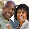 Older man and woman smiling together