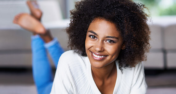 Smiling woman with curly hair