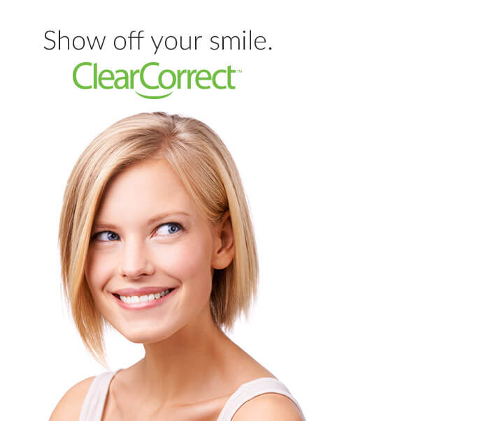 Smiling woman with text above her head saying show off your smile ClearCorrect