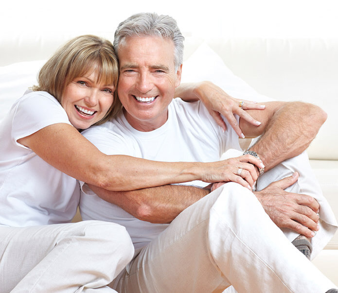 Senior man and woman smiling together