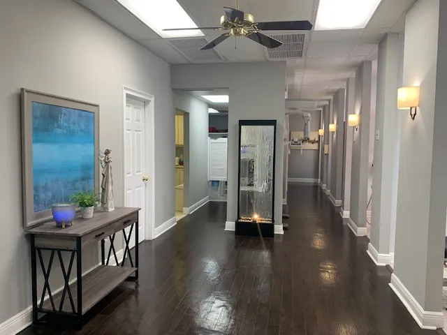 Hallway branching off into dental treatment rooms