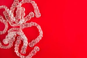clear aligners on red background