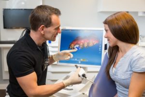 dentist designing a same-day dental crown for a patient