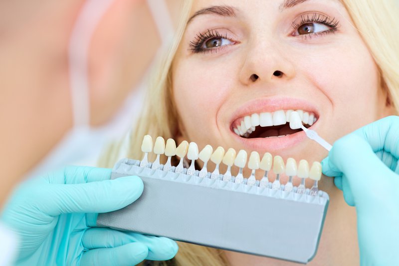 woman getting dental crown color-matched